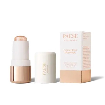 Stick highlighter de color dorado junto a su caja de la marca Paese